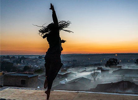Kitty dancing on the rooftop