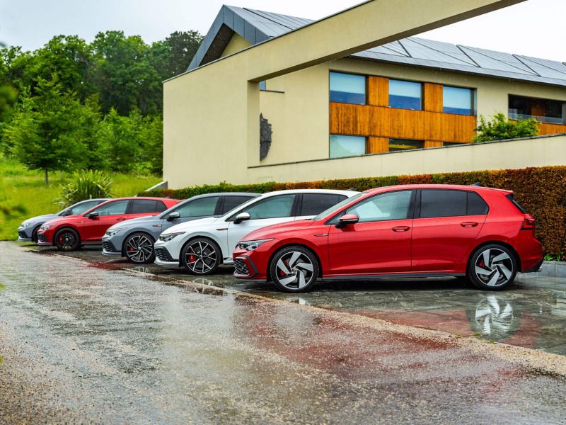 A selection of various Mk 8 VW Golf GTIs parked next to each other in the rain