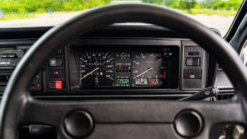 A close up of the steering wheel and speedometer in a Mk 1 VW Golf GTI