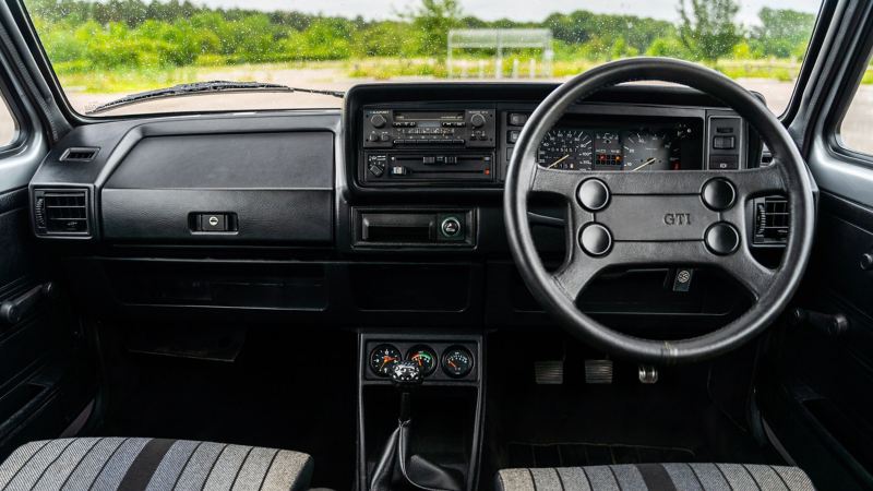 An interior shot of the front cabin of a Mk 1 VW Golf GTI