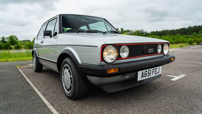 A front 3/4 shot of a silver Mk 1 VW Golf GTI