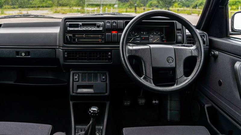 An interior shot of the front cabin of a Mk 2 VW Golf GTI