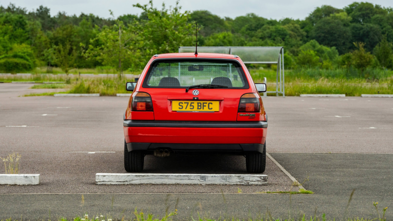 A rear shot of a red Mk 3 VW Golf GTI 