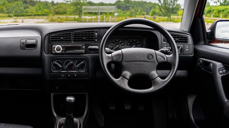 An interior shot of the front cabin of a Mk 3 VW Golf GTI