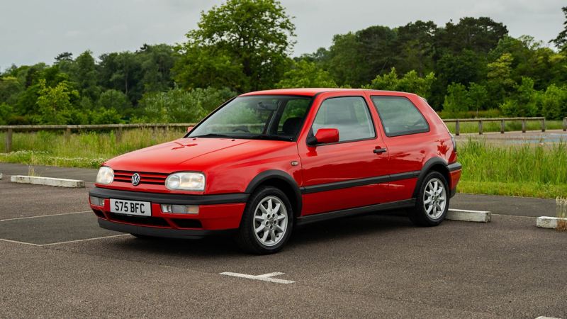 A front 3/4 shot of a red Mk 3 VW Golf GTI