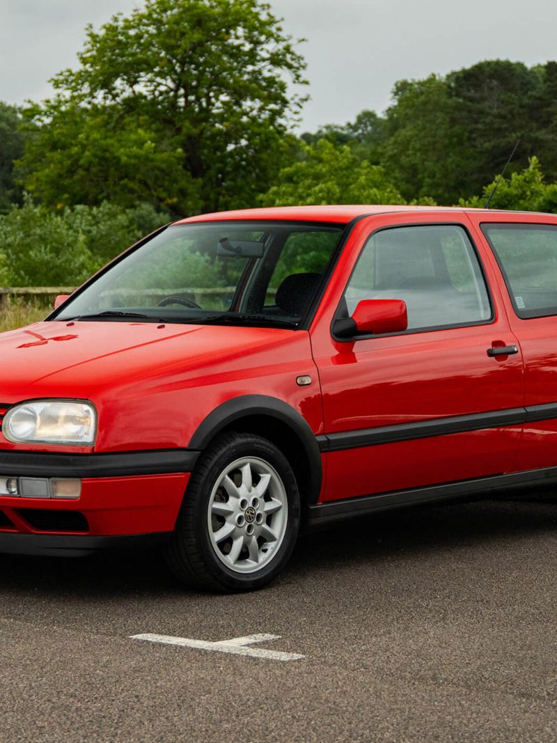 A front 3/4 shot of a red Mk 3 VW Golf GTI