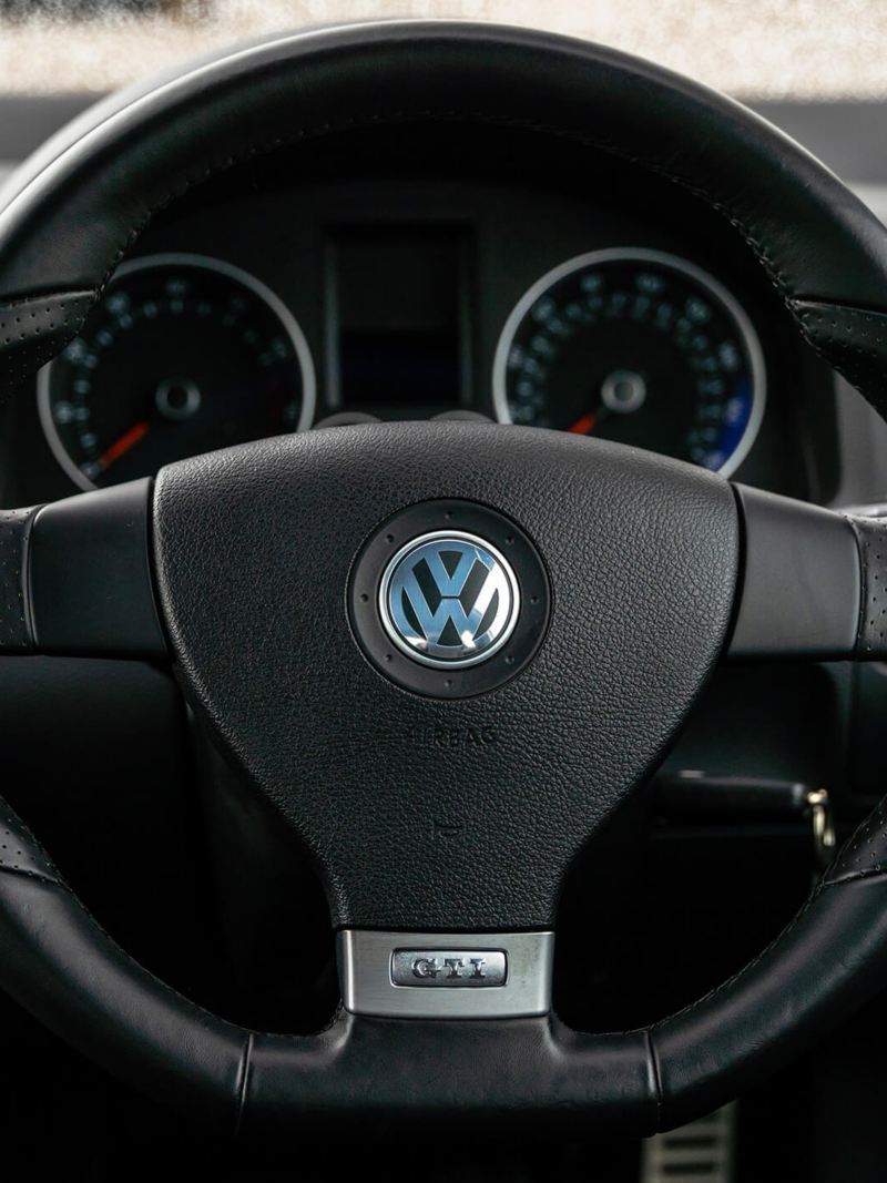 A close up of the steering wheel in a Mk 5 VW Golf GTI