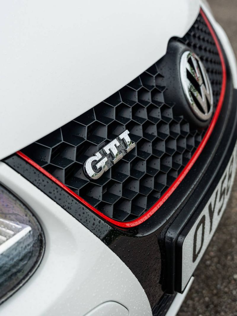 The radiator grille of a white Mk 5 VW Golf GTI