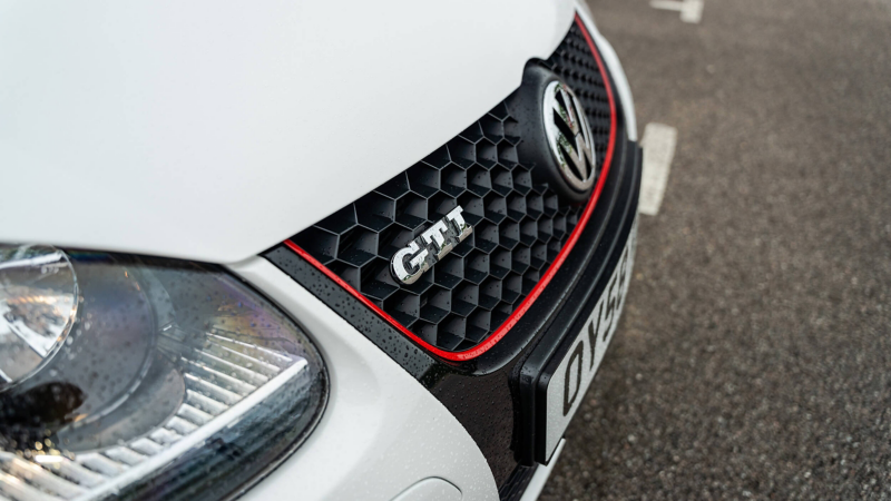 The radiator grille of a white Mk 5 VW Golf GTI