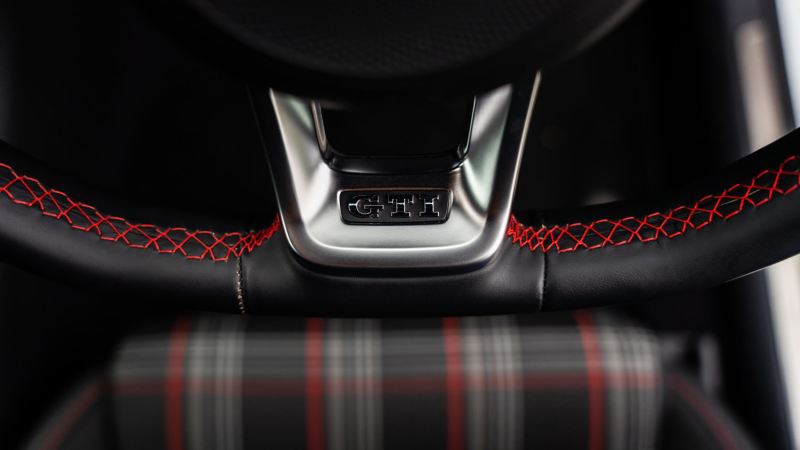 A close up of the GTI logo on the steering wheel of a Mk 7 VW Golf GTI