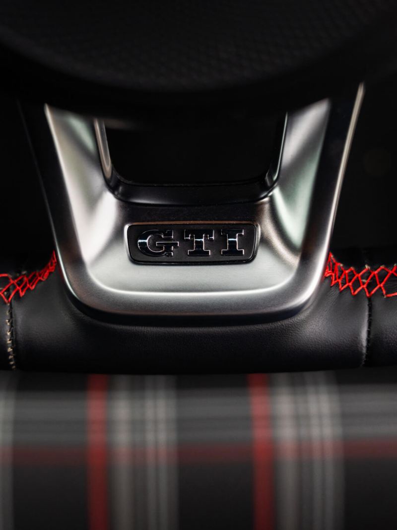 A close up of the GTI logo on the steering wheel of a Mk 7 VW Golf GTI