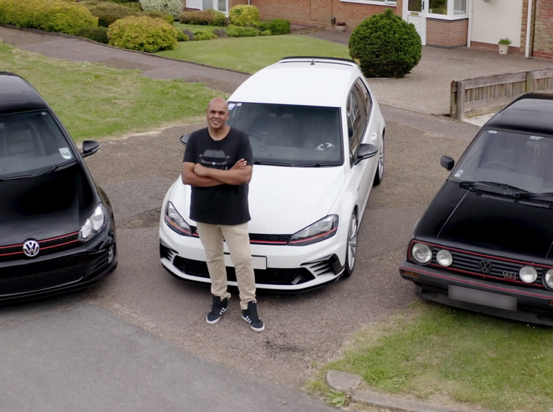 Chandrin stands in front of his Golf GTI collection