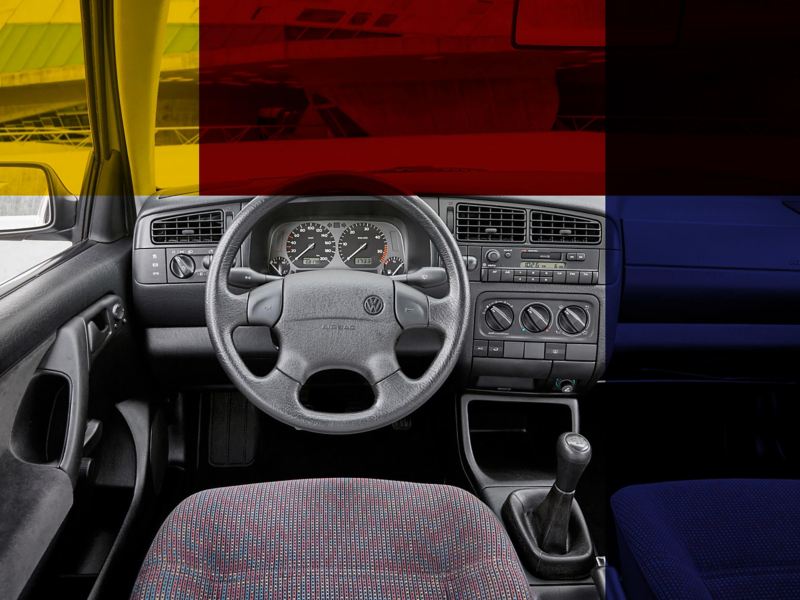 The interior front dash and steering wheel of a Golf mark 3