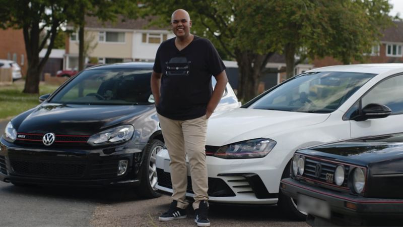 Chandrin stands in front of his white Golf GTI Mk7 Clubsport S