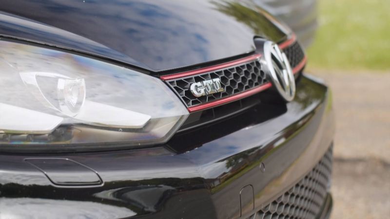 The front grille of a black Golf GTI MK6