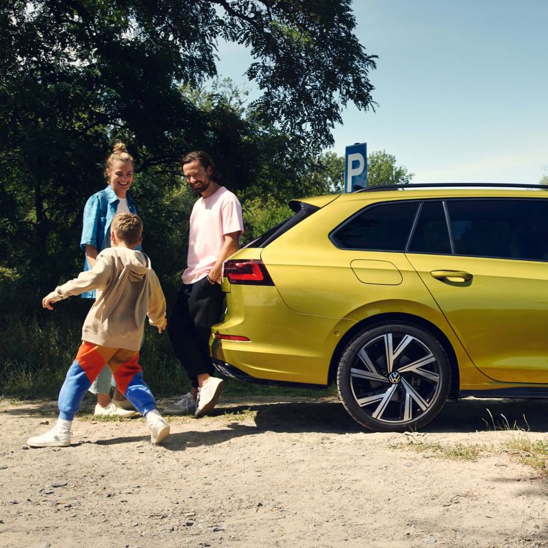 A family standing at the back of a Golf 8 Estate