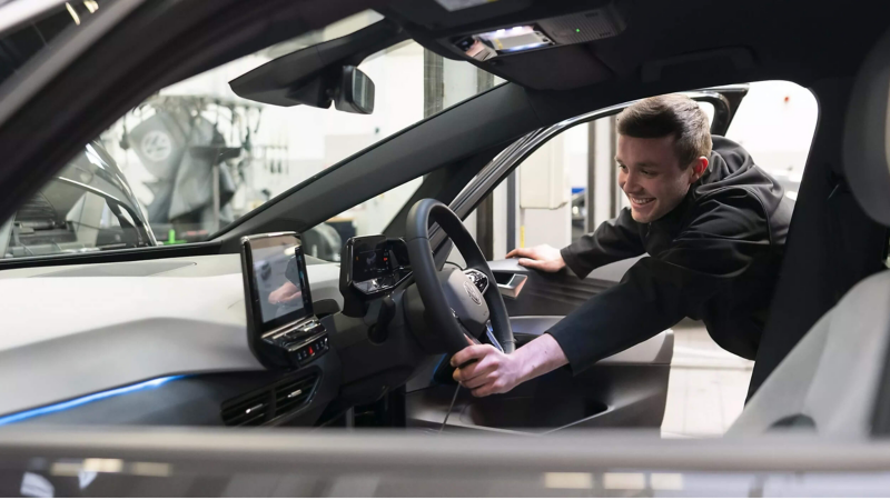 Person opening the door of the electric vehicle