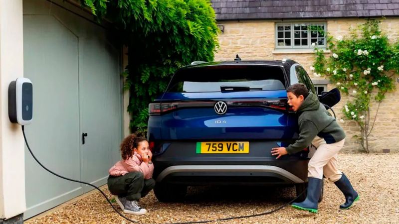 children playing near a charging ID.4