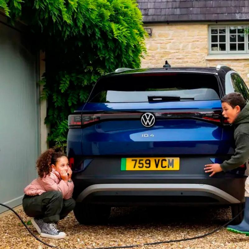 children playing near a charging ID.4