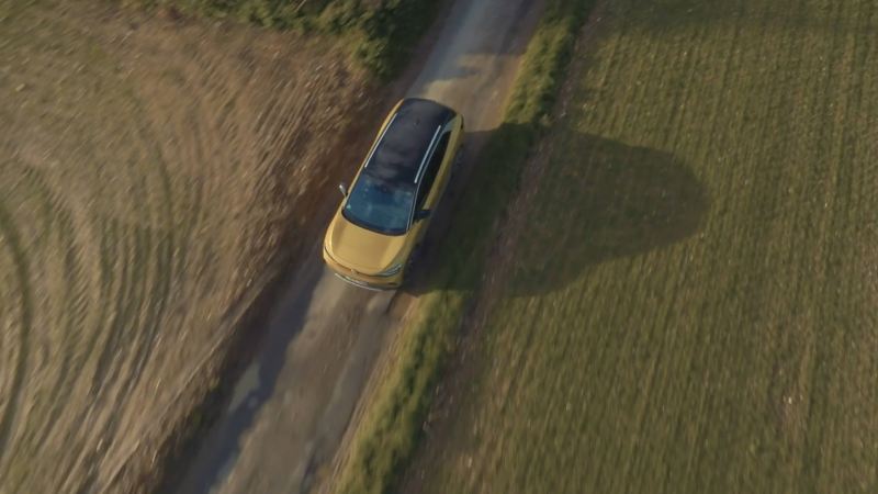 An aerial photo showing an ID.4 from above driving through the countryside.