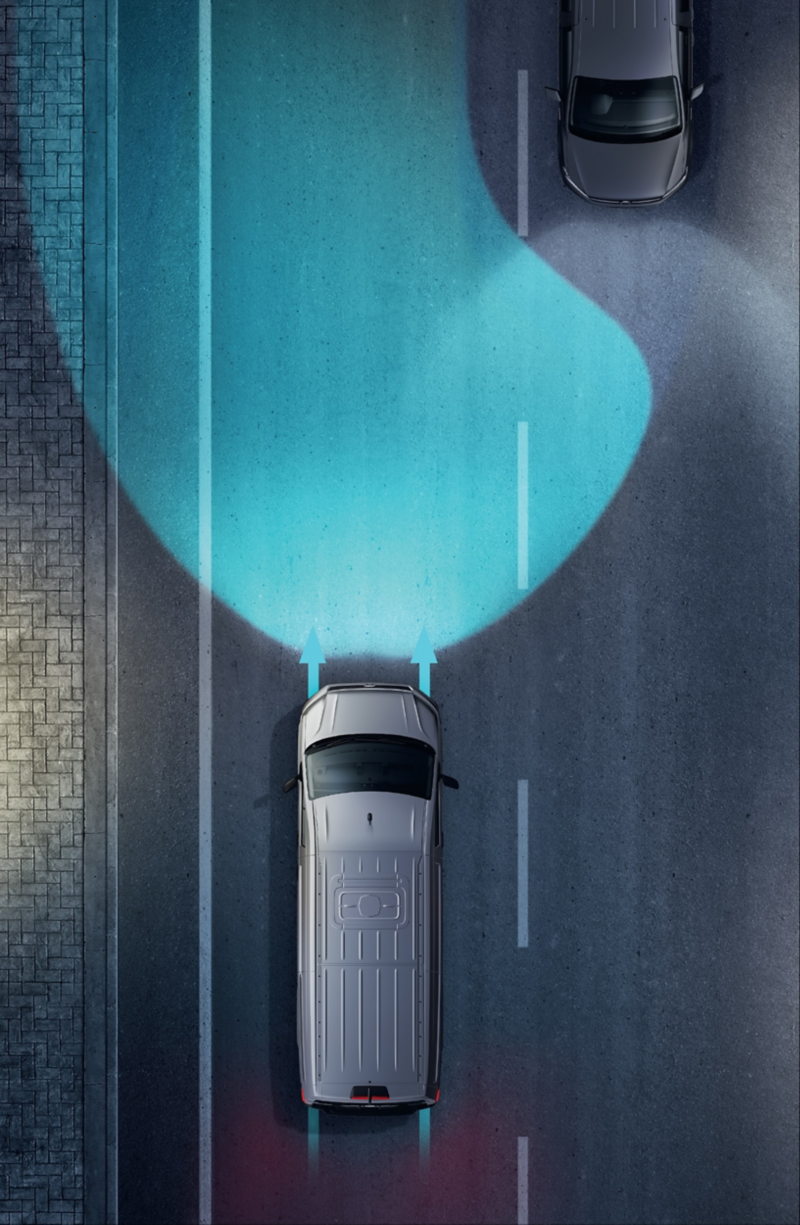 A Volkswagen van demonstrating high beam assist on the road