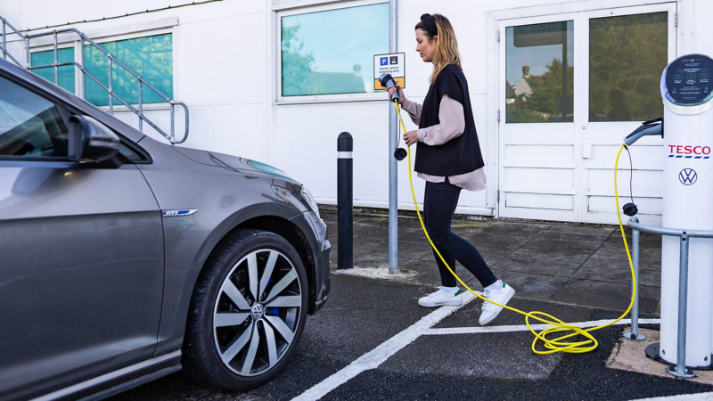 Angel at a VW Tesco partnership charging station just about to plug in her Golf GTE