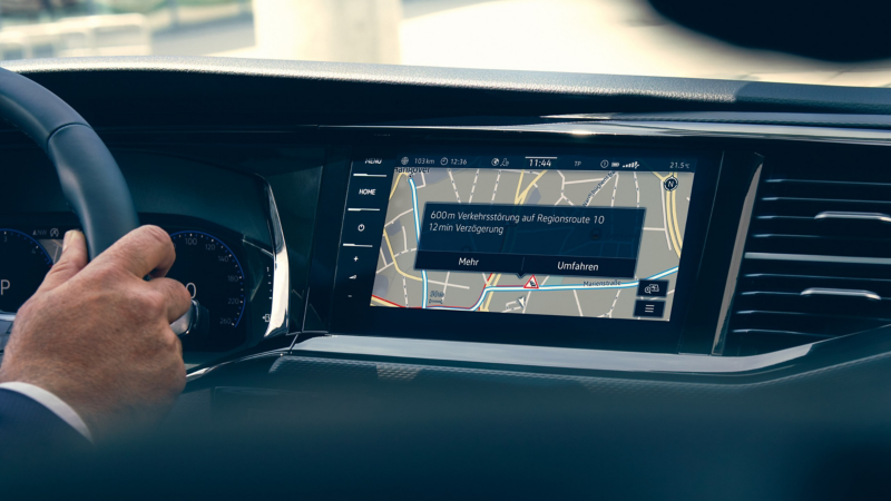 The navigation device in a Volkswagen commercial vehicle showing the real-time navigation in use.