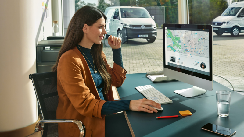 image showing person sitting at a desk using a computer