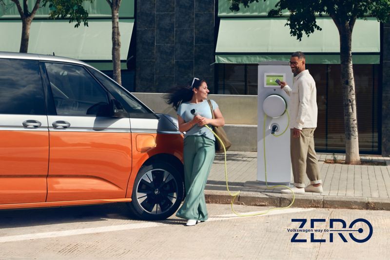 A VW Multivan Energetic stands at a charging station.