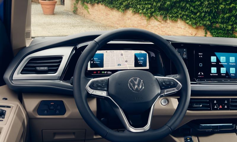 Interior view of a Multivan with a steering wheel and dashboard on display