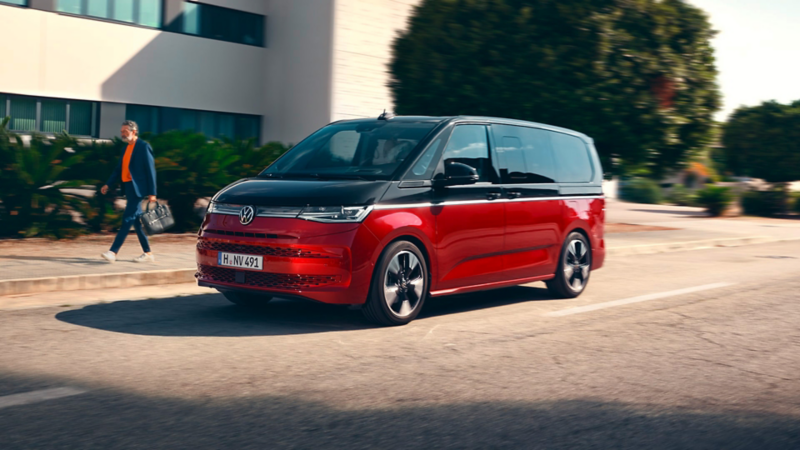 The VW Multivan Style drives on the road.