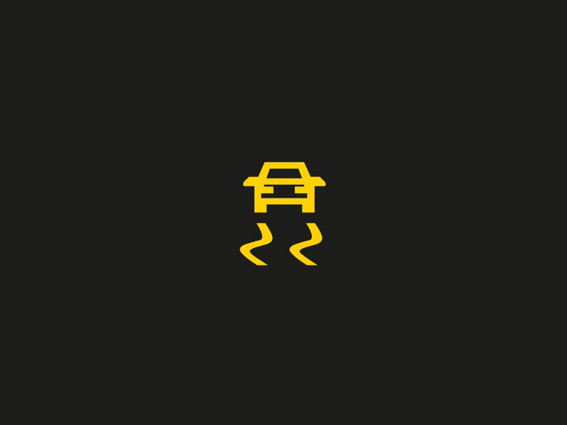 Amber electronic stability control (ESC) or traction control system (TCS) regulating warning light 