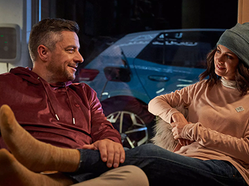 Couple sat on sofa