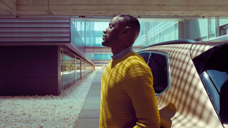 A man stood beside a Volkswagen vehicle