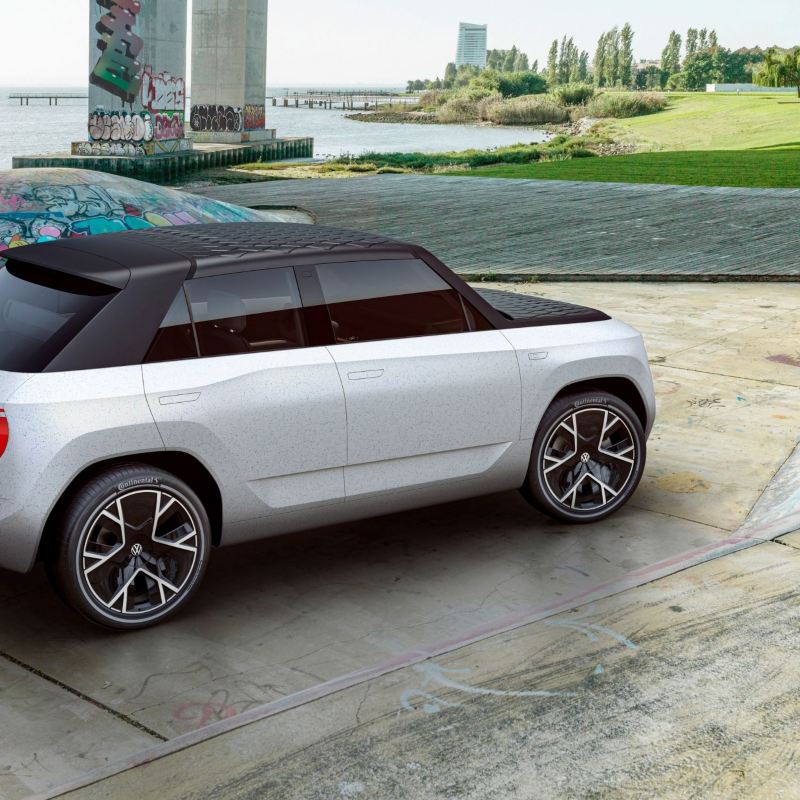 A CGI mock-up of the VW ID. Life concept car in a futuristic urban environment