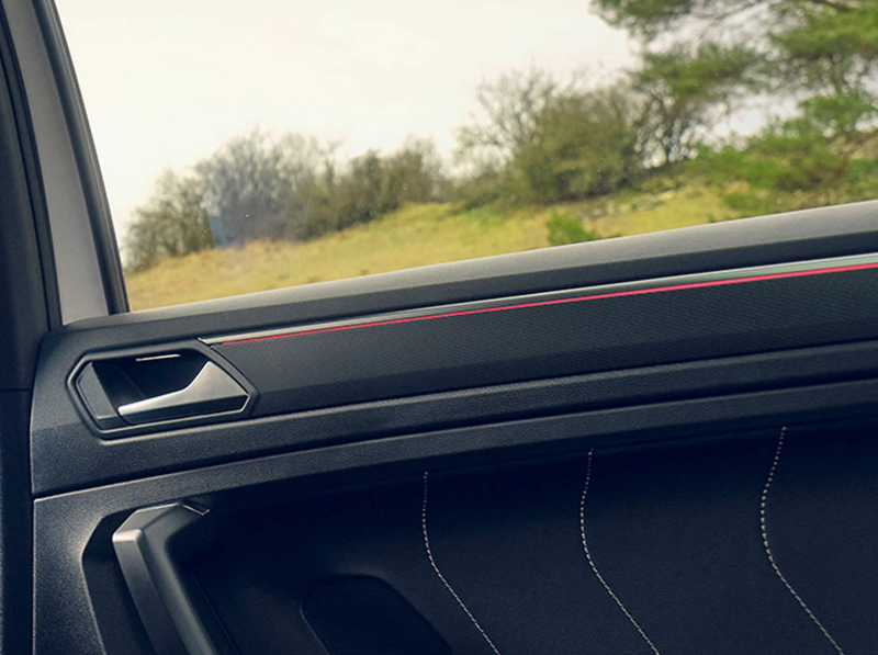 Detail of the ambient lighting in the rear door of a Tiguan Allspace R-Line.
