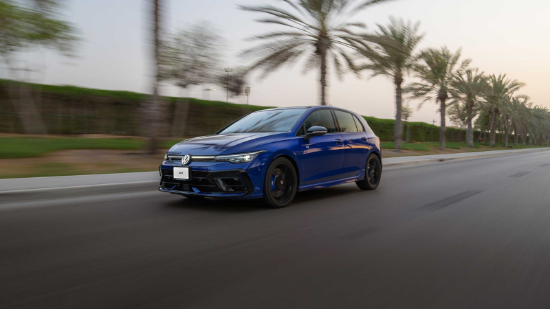 VW Golf R in front of a factory building