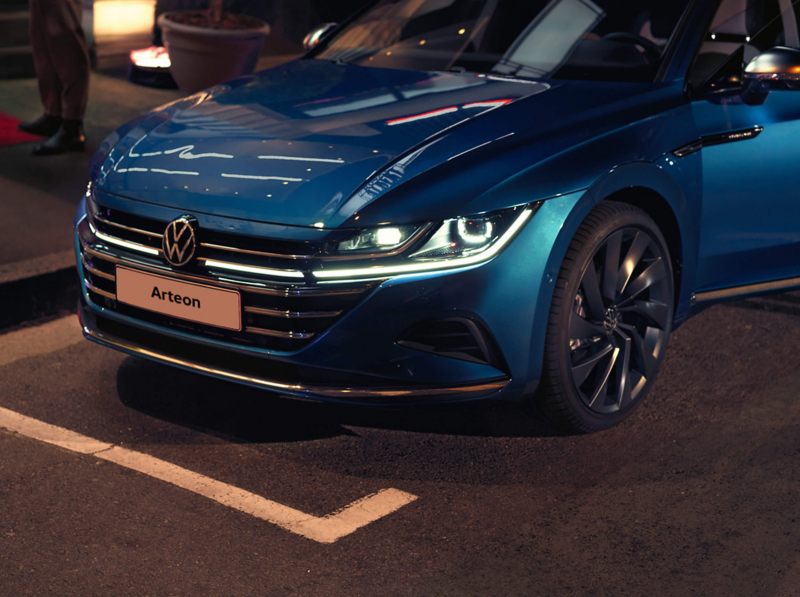 A new Arteon parked up with front lights on