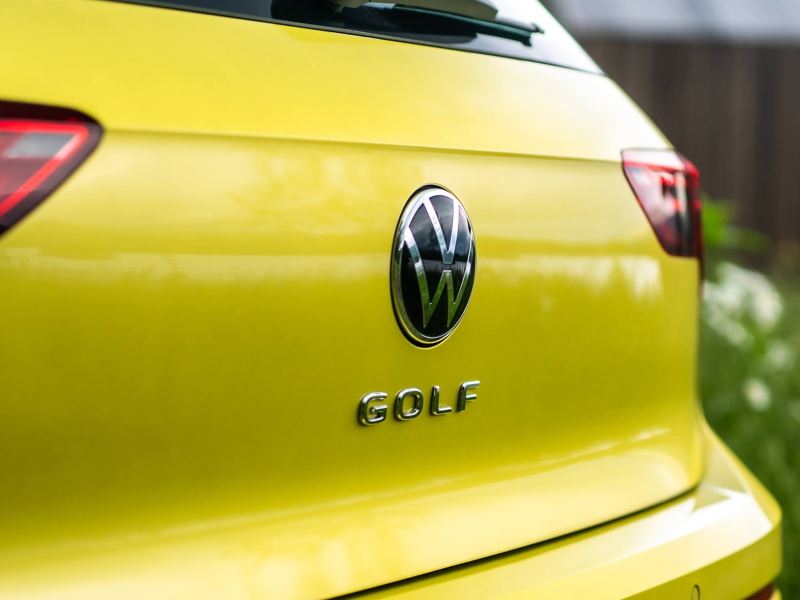 The Golf badge on a yellow Golf 8