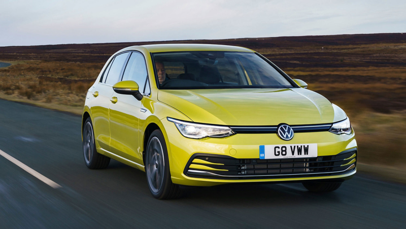 Front view of a yellow VW Golf on the road