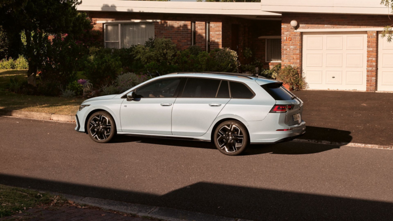 White VW Golf Estate parked sideways on the road.