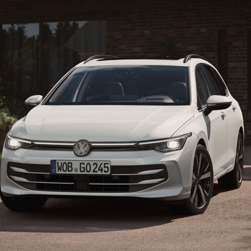 A white Golf Estate from the front