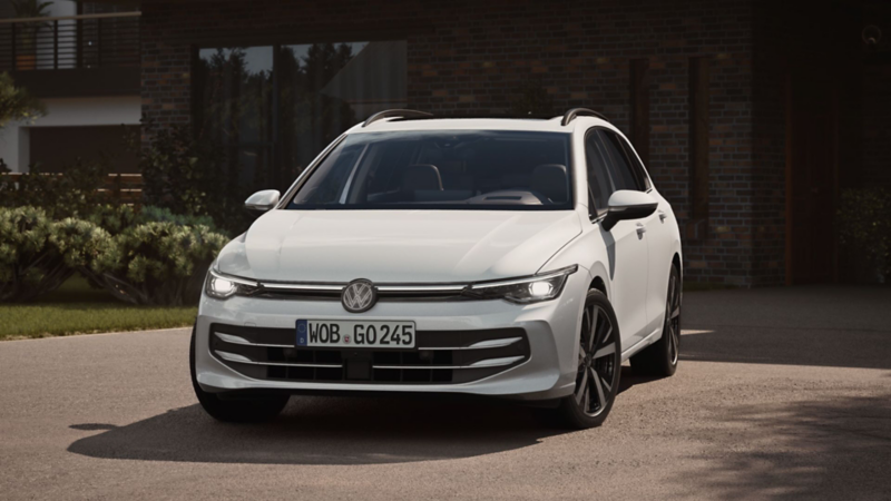 A white Golf Estate from the front