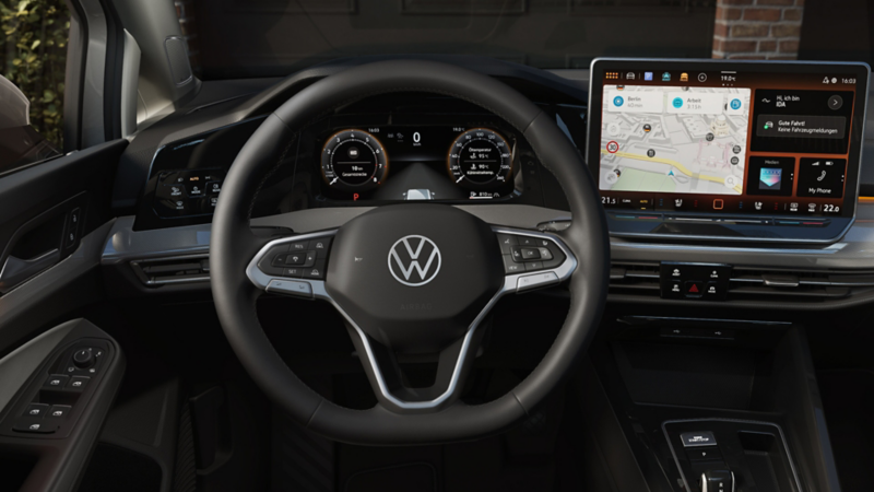 A close up view of the front dashboard from the drivers seat