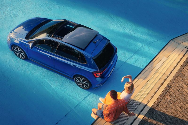 View from above of a blue VW Polo with panoramic sliding roof.