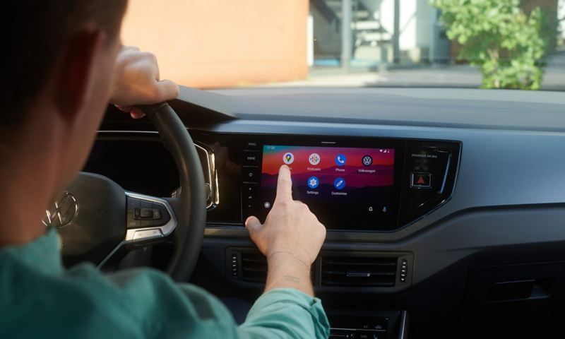 A man using infotainment screen