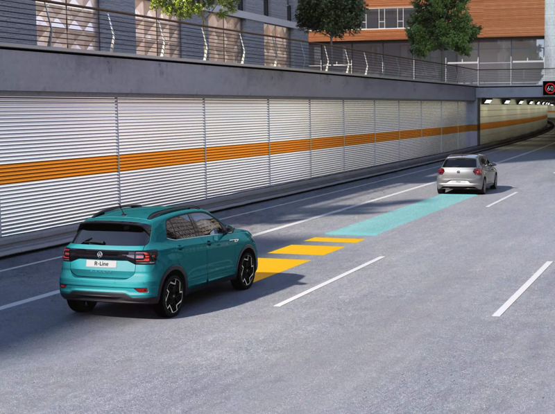 teal T-Cross driving on a road with arrows to demonstrate travel assist functionality