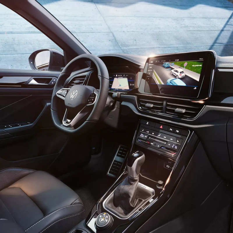 Interior shot of a VW including the steering wheel and multimedia display