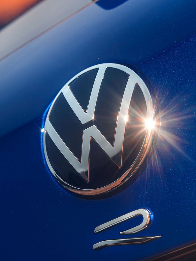 The Volkswagen R logo on the Tiguan R reflects the sunlight