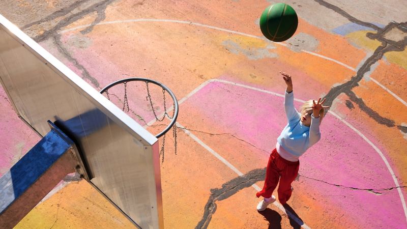 A woman playing basketball